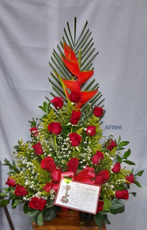 Arreglo floral heliconia y rosas rojas