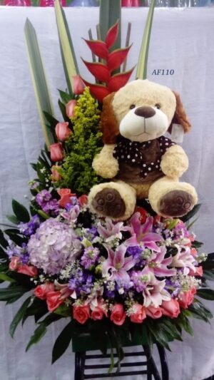 Arreglo floral rosas, orquídeas y peluche