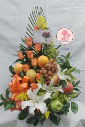 Arreglo frutal lirios y rosas