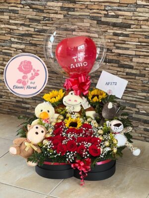 Caja de peluches, girasoles, rosas y chocolates.